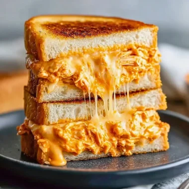 Delicious Buffalo Chicken Grilled Cheese Sandwich with melted cheese and spicy chicken