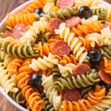 Bowl of easy and delicious Italian pasta salad with fresh vegetables and herbs
