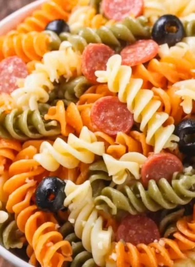Bowl of easy and delicious Italian pasta salad with fresh vegetables and herbs