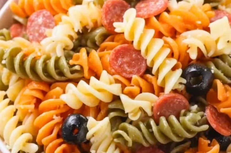 Bowl of easy and delicious Italian pasta salad with fresh vegetables and herbs