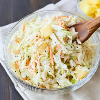 Bowl of Hawaiian Coleslaw with colorful ingredients, showcasing its tropical flavors.