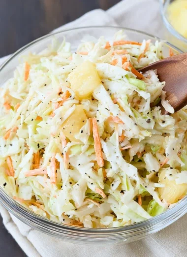 Bowl of Hawaiian Coleslaw with colorful ingredients, showcasing its tropical flavors.