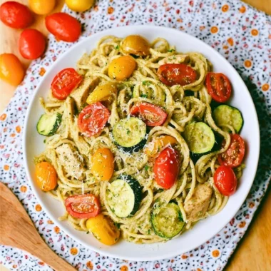 Summer Pasta with Parmesan, Zucchini, Tomato, and Chicken in a bowl