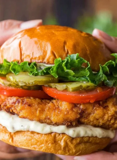 Delicious Ultimate Crispy Chicken Sandwich with toppings and sauce