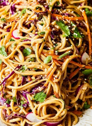 Asian Noodle Salad with colorful vegetables in a rich peanut dressing