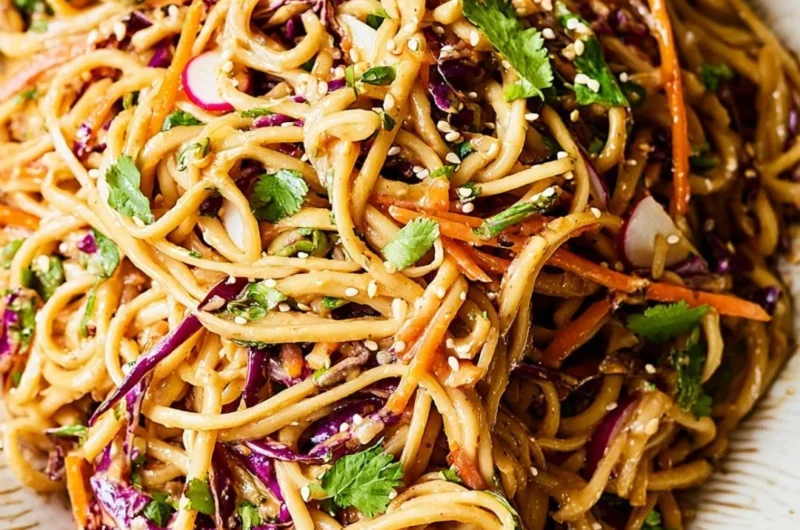 Asian Noodle Salad with colorful vegetables in a rich peanut dressing