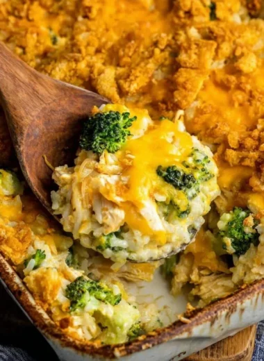 Broccoli Cheddar Chicken Casserole with rice and melting cheese, baked to perfection.