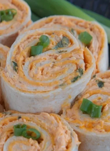 Buffalo Chicken Pinwheels served on a platter with fresh veggies