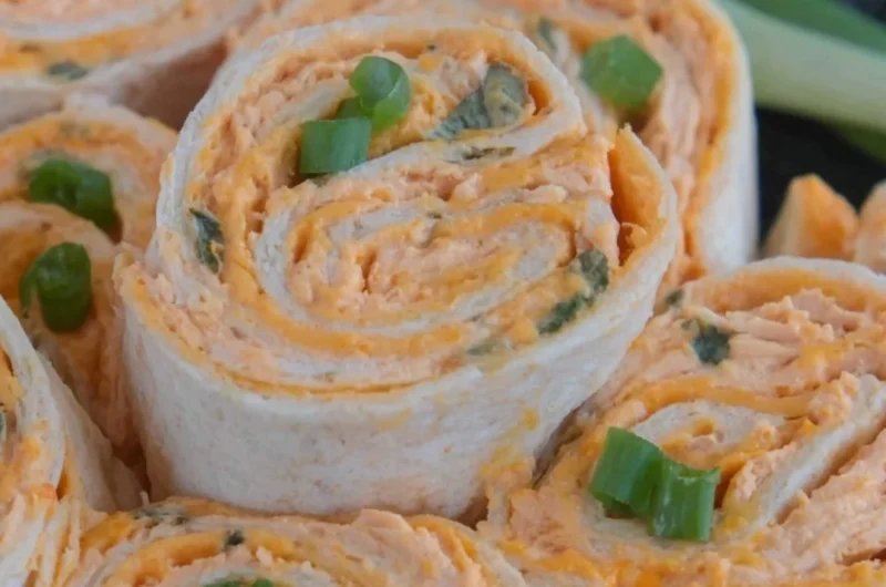 Buffalo Chicken Pinwheels served on a platter with fresh veggies