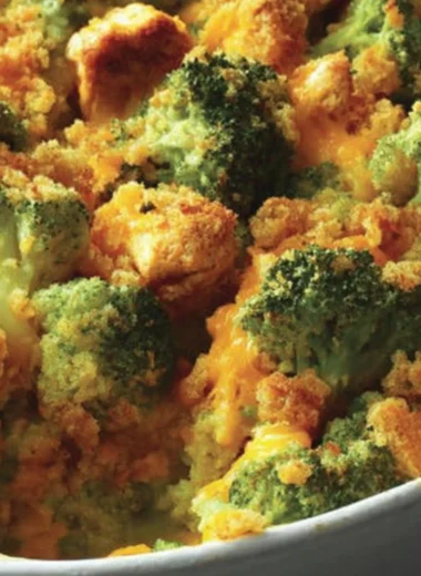 A delicious bowl of contest-winning broccoli chicken casserole topped with cheese.