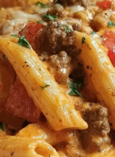 Creamy Rotel Pasta dish topped with ground beef and cheese