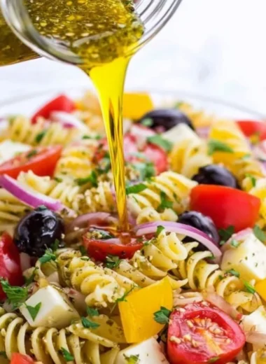 A bowl of homemade Italian dressing with herbs and spices