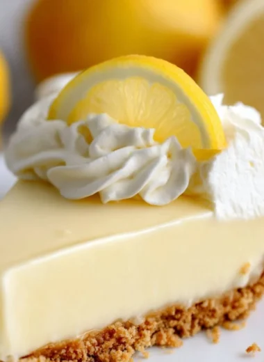 Delicious Magnolia Lemon Pie topped with whipped cream and lemon zest