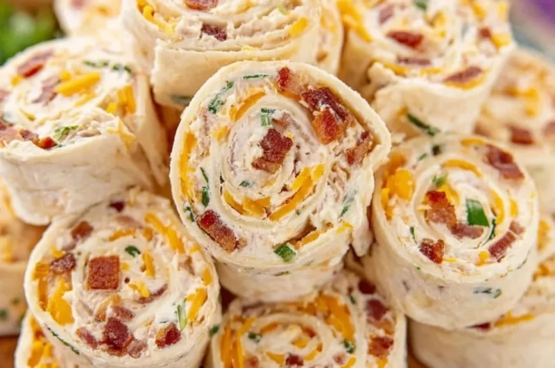 Colorful potluck pinwheels served on a platter at a gathering.