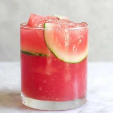 Refreshing watermelon cocktail punch served in a glass with mint and ice