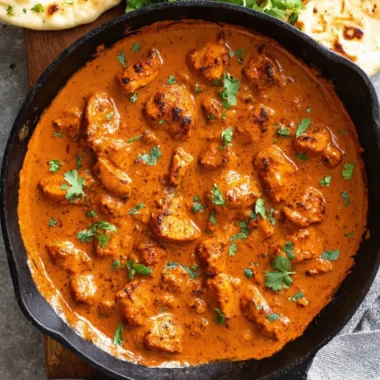 Delicious Chicken Tikka Masala served with rice and naan