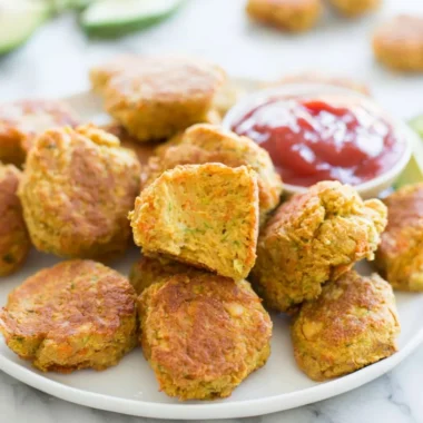 Delicious chickpea nuggets served with dipping sauce on a plate
