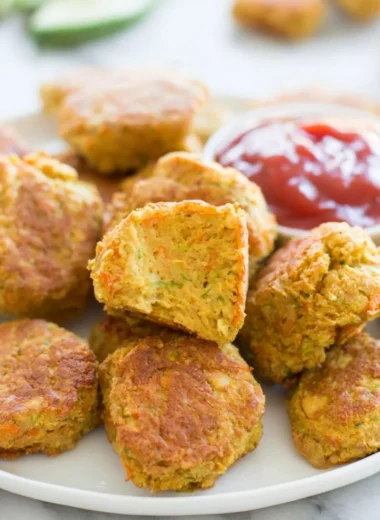 Delicious chickpea nuggets served with dipping sauce on a plate