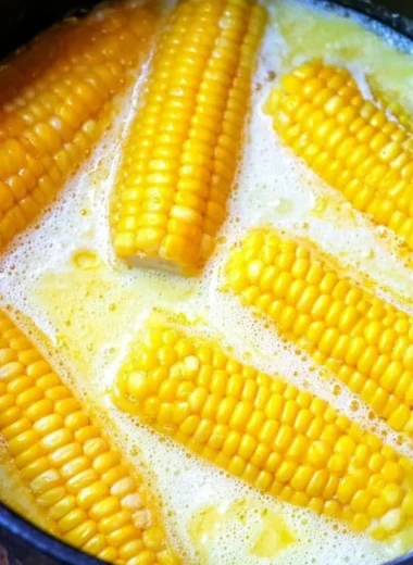 Fresh, grilled corn on the cob served with butter and herbs