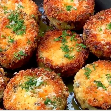 Crispy breaded eggplant slices arranged on a plate