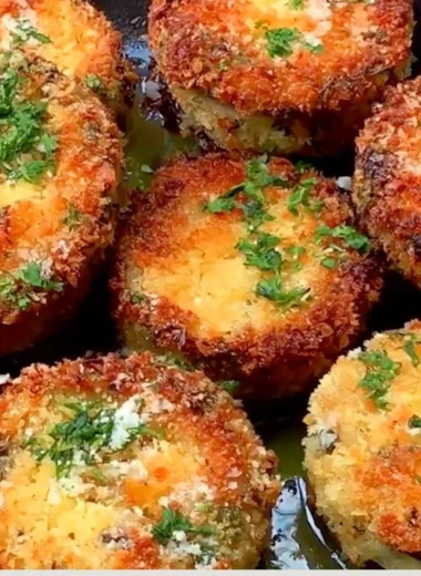 Crispy breaded eggplant slices arranged on a plate