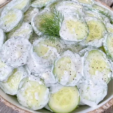 Refreshing cucumber salad with mayo and sour cream in a bowl