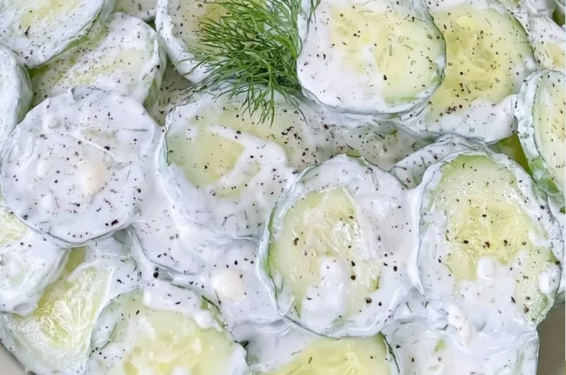 Refreshing cucumber salad with mayo and sour cream in a bowl