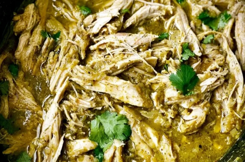 Delicious Green Sauce Crockpot Chicken served with fresh herbs