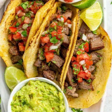 Delicious grilled beef tacos served with fresh toppings