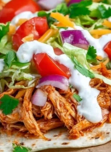 Delicious Mexican Pulled Chicken served in a colorful taco bowl