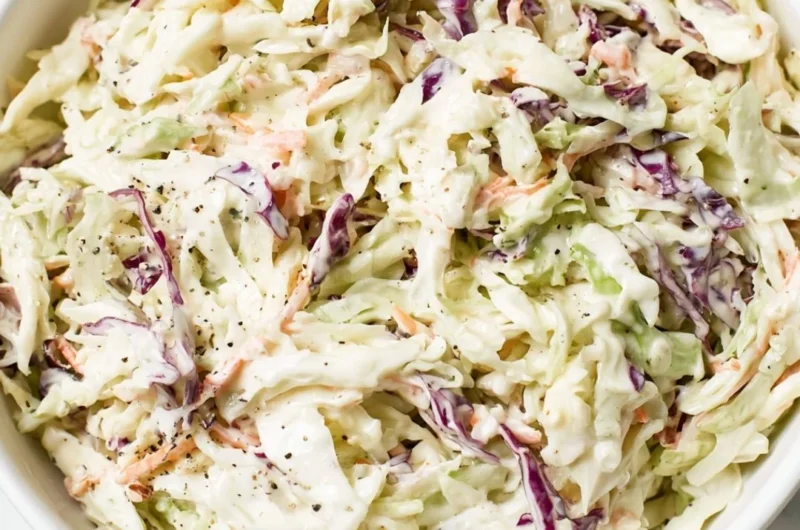 Bowl of perfectly balanced coleslaw with vibrant cabbage and carrots