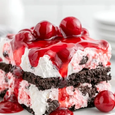 Delicious Black Forest Icebox Cake with chocolate layers and cherry topping