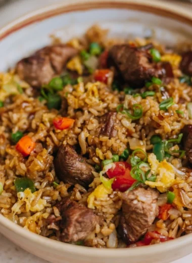 Cozy steak fried rice with vegetables and tender beef in a bowl