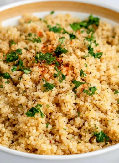 Delicious garlic butter quinoa served in a bowl with fresh herbs