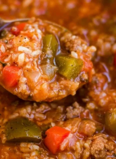 Bowl of Instant Pot stuffed pepper soup with peppers and herbs