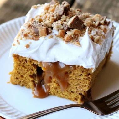 Deliciously moist caramel pumpkin poke cake topped with whipped cream and caramel drizzle.