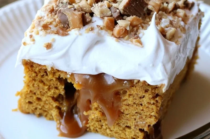 Deliciously moist caramel pumpkin poke cake topped with whipped cream and caramel drizzle.