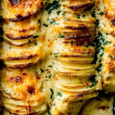 Cheesy scalloped potatoes served in a cozy dish, ideal for comforting meals.