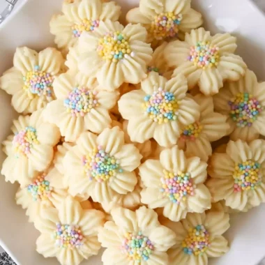 Lemon Spritz Cookies with a crispy texture and lemon zest decoration