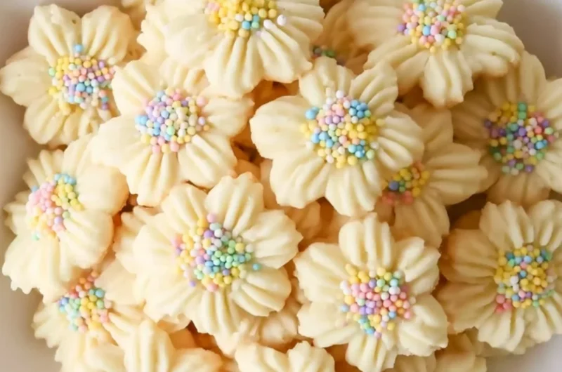 Lemon Spritz Cookies with a crispy texture and lemon zest decoration