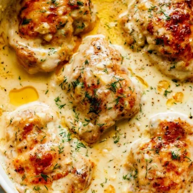 Creamy oven baked chicken thighs served on a plate