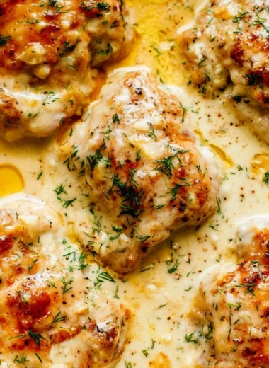 Creamy oven baked chicken thighs served on a plate
