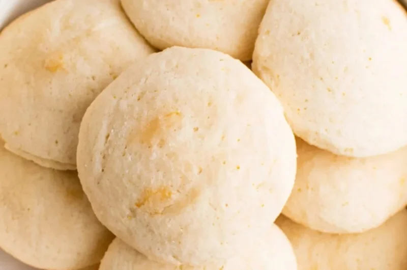 Plate of easy orange whipped shortbread cookies with zesty orange flavor.